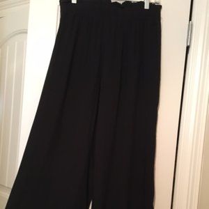 Black, elastic waisted, full pants with pockets